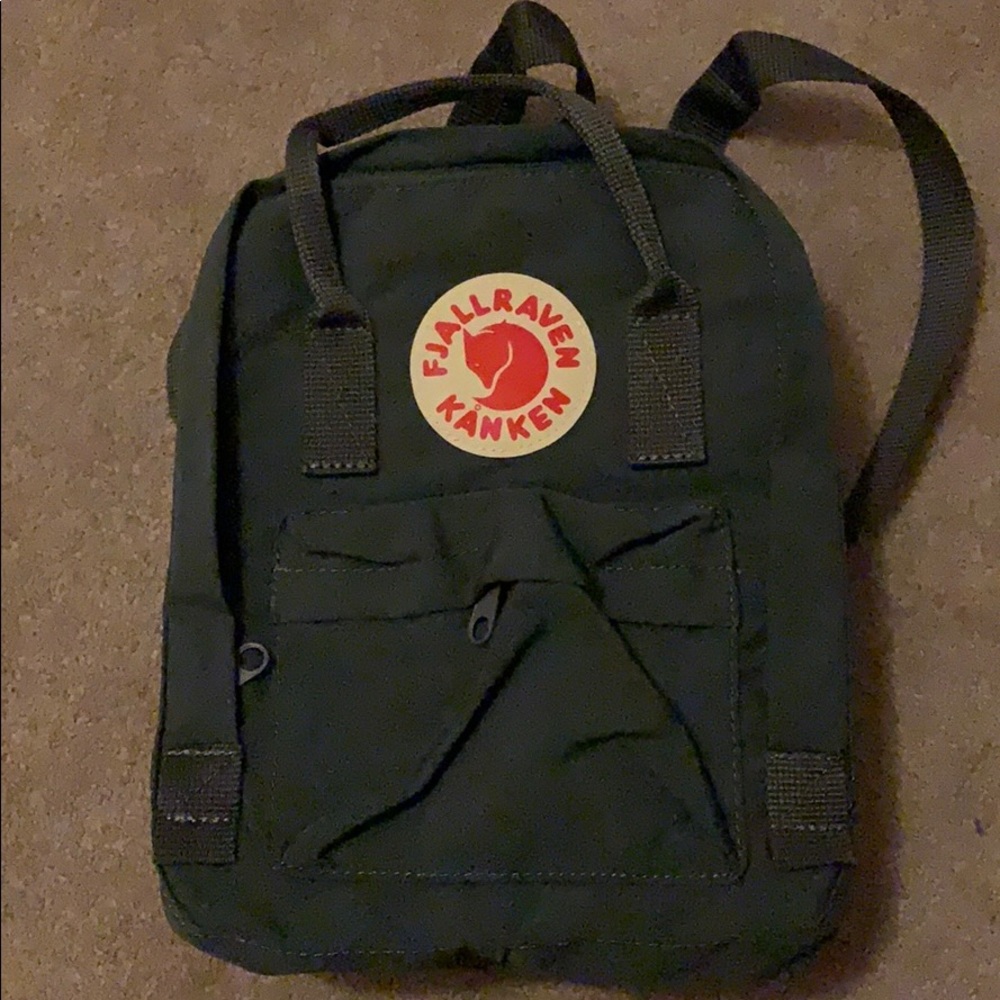Mini fjallraven grey backpack.